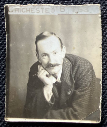 posed portrait of a man sporting a large moustache